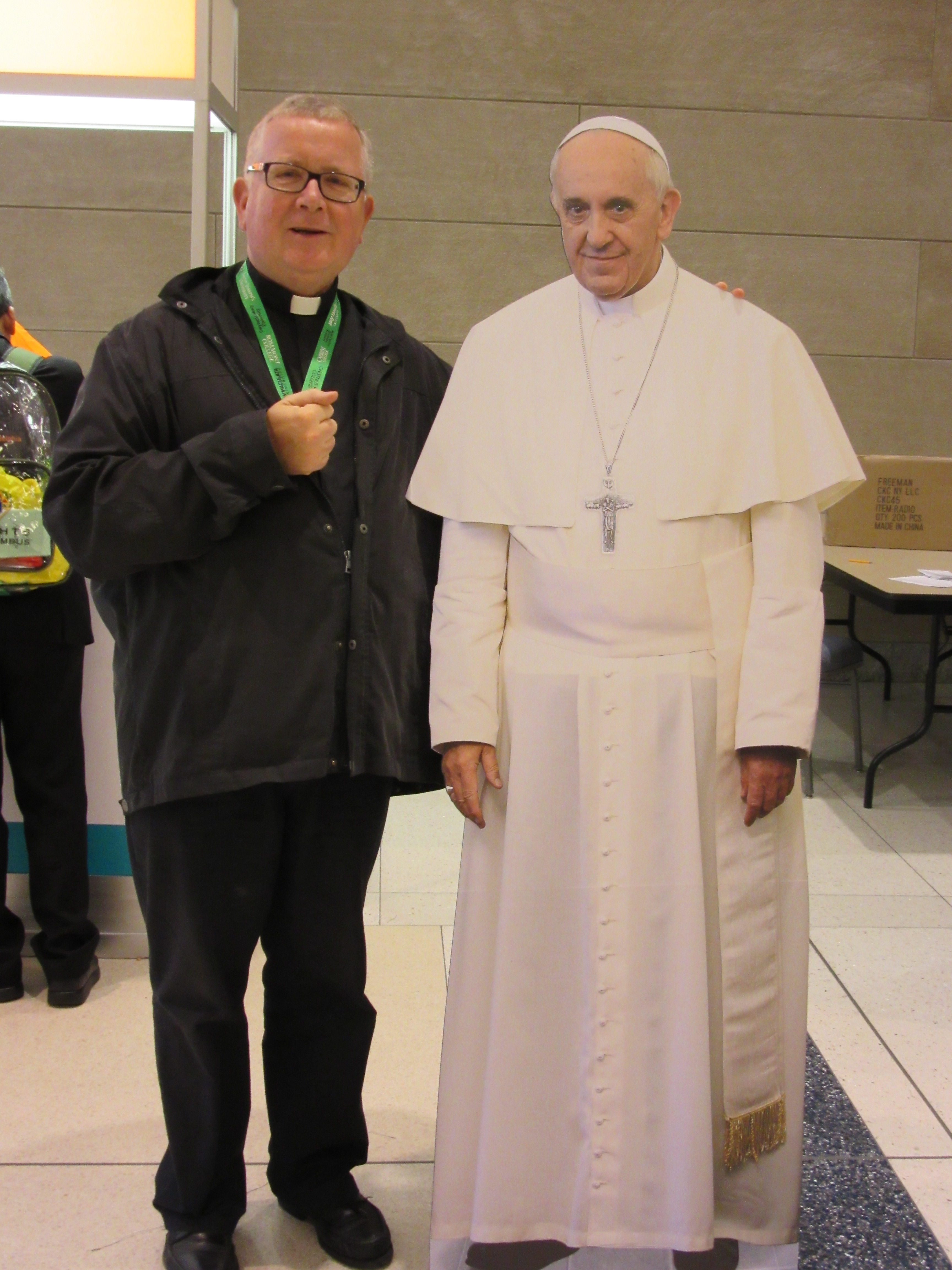 Fr Denis Metzinger with one of the photos of Pope Francis (Philadelphia 2015)