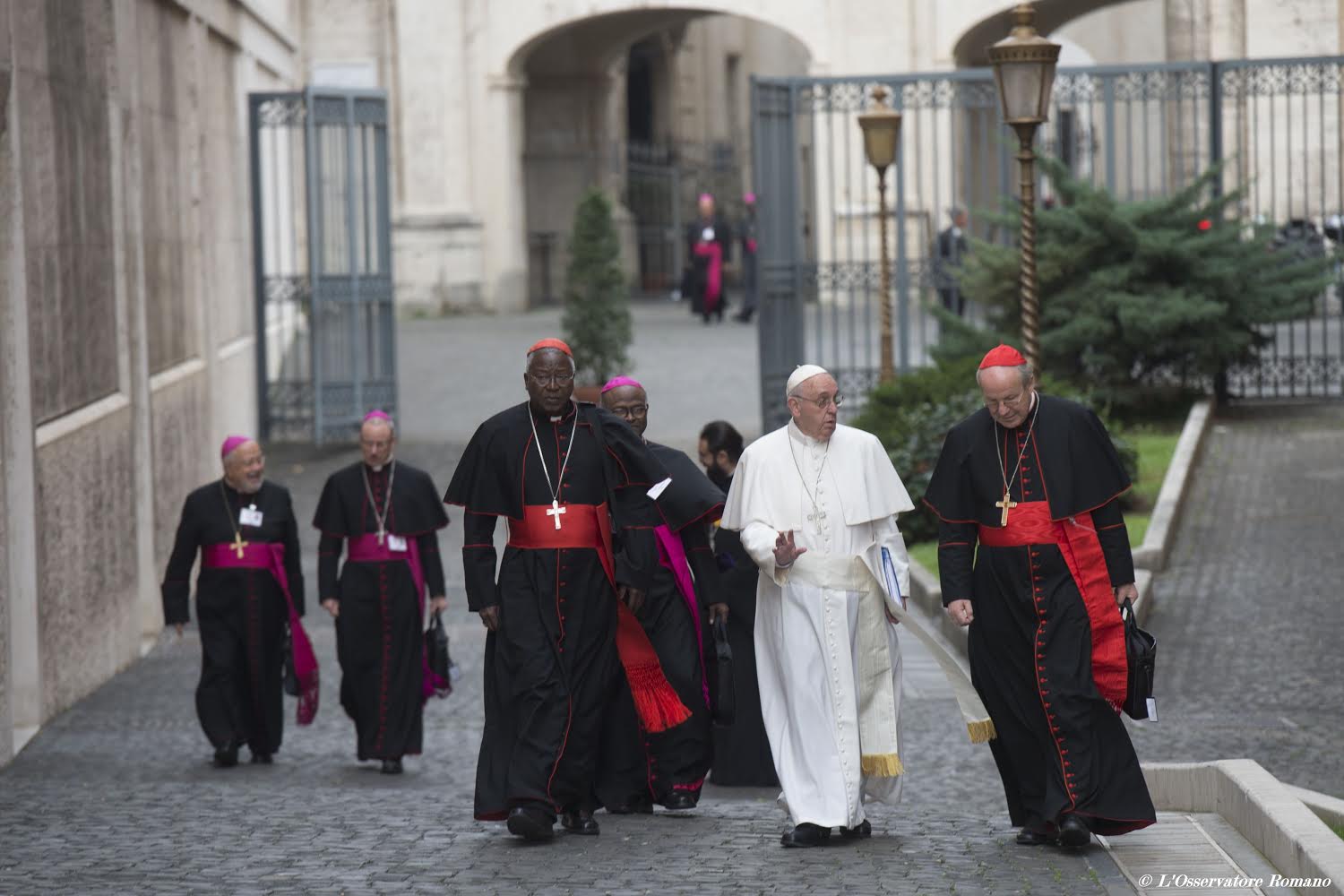 Pope Francis walks to the session of the Synod of Bishops on the Family