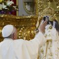 Pope Francis caresses the statue of Our Lady of Quinche