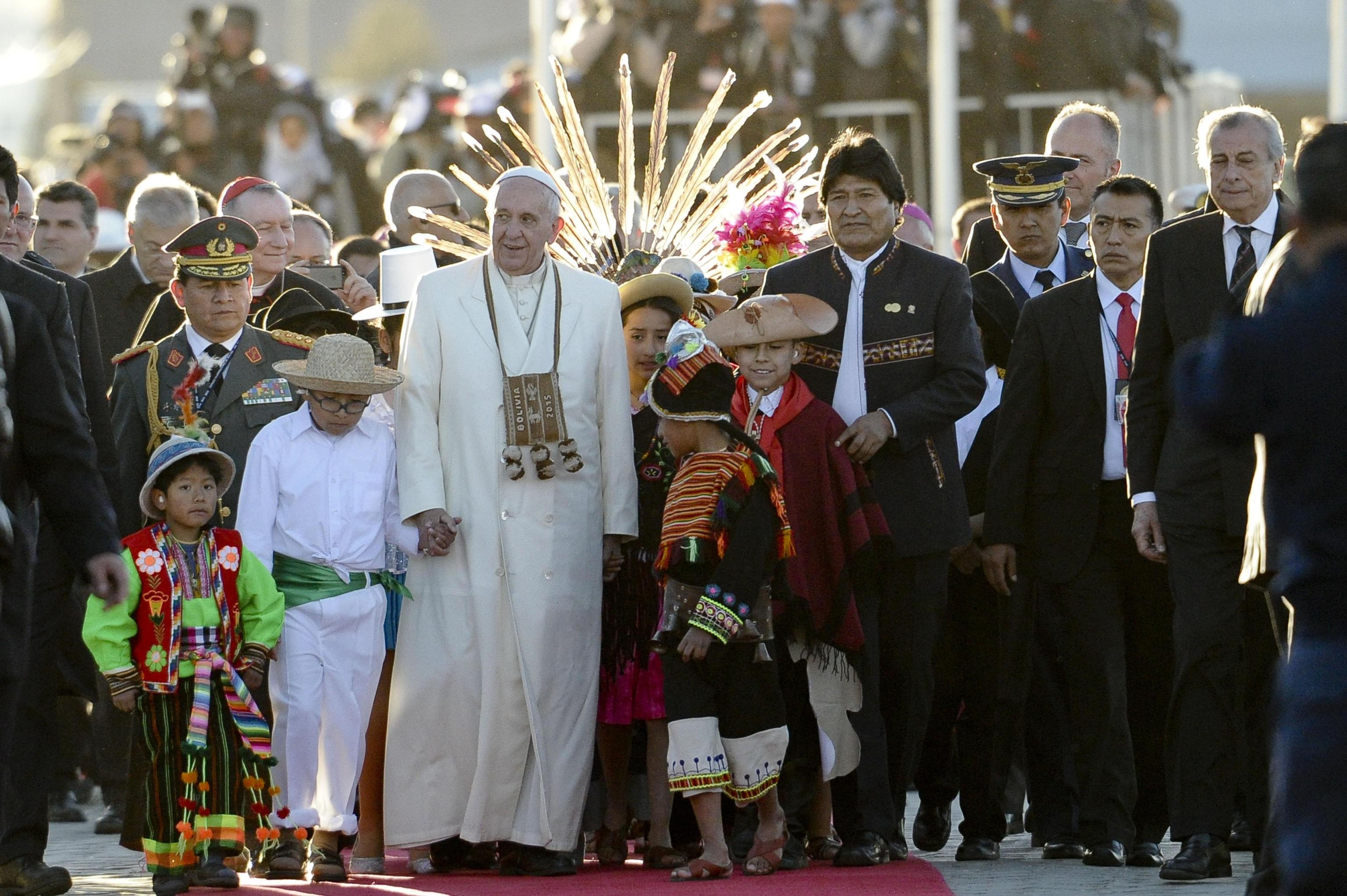 Pope Francis being greeted by children at his arrival at the El Alto International Airport