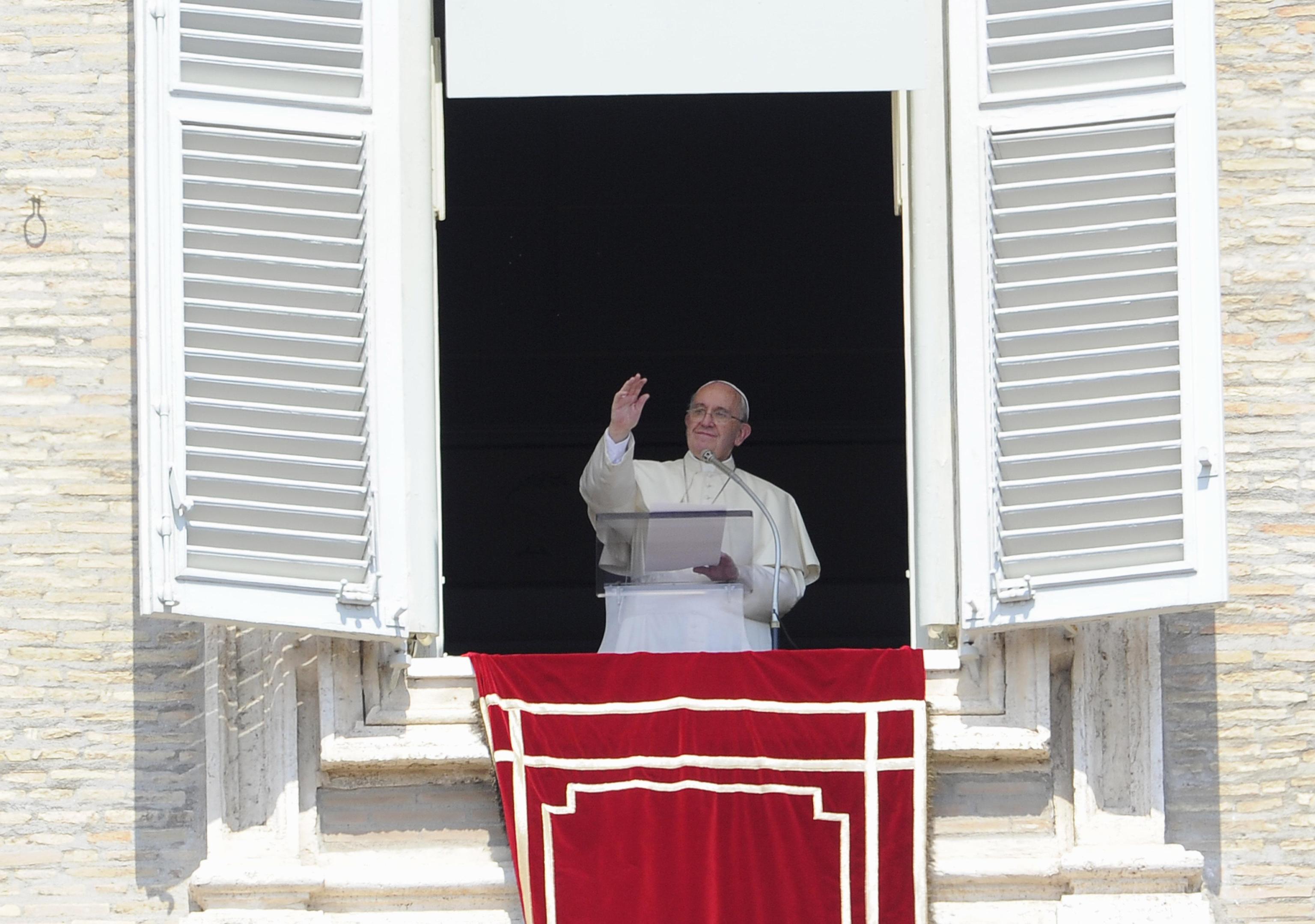 Pope Francis greets faithful during the Angelus in St. Peter square