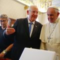 Pope Francis listens to Israel's President Reuven Rivlin as they exchange gifts during a private audience in the Pontiff's private library at the Vatican