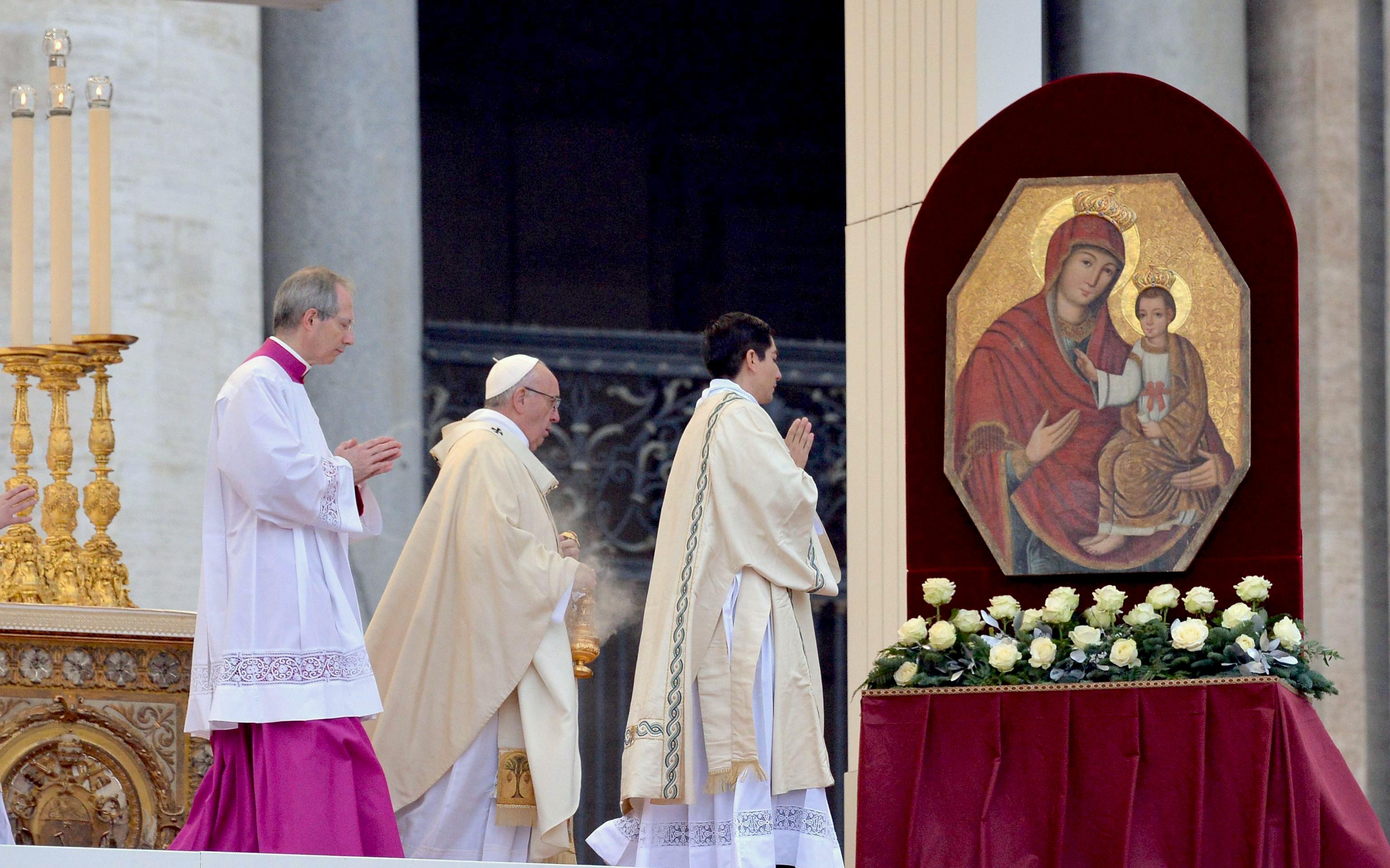 Pope Francis celebrates a Mass prior to the opening of the Holy Door of Saint Peter's Basilica