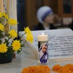 Nuns take part in a mass prayer in front of the Mother Teresa's tomb at Mother House in Calcutta