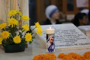 Nuns take part in a mass prayer in front of the Mother Teresa's tomb at Mother House in Calcutta