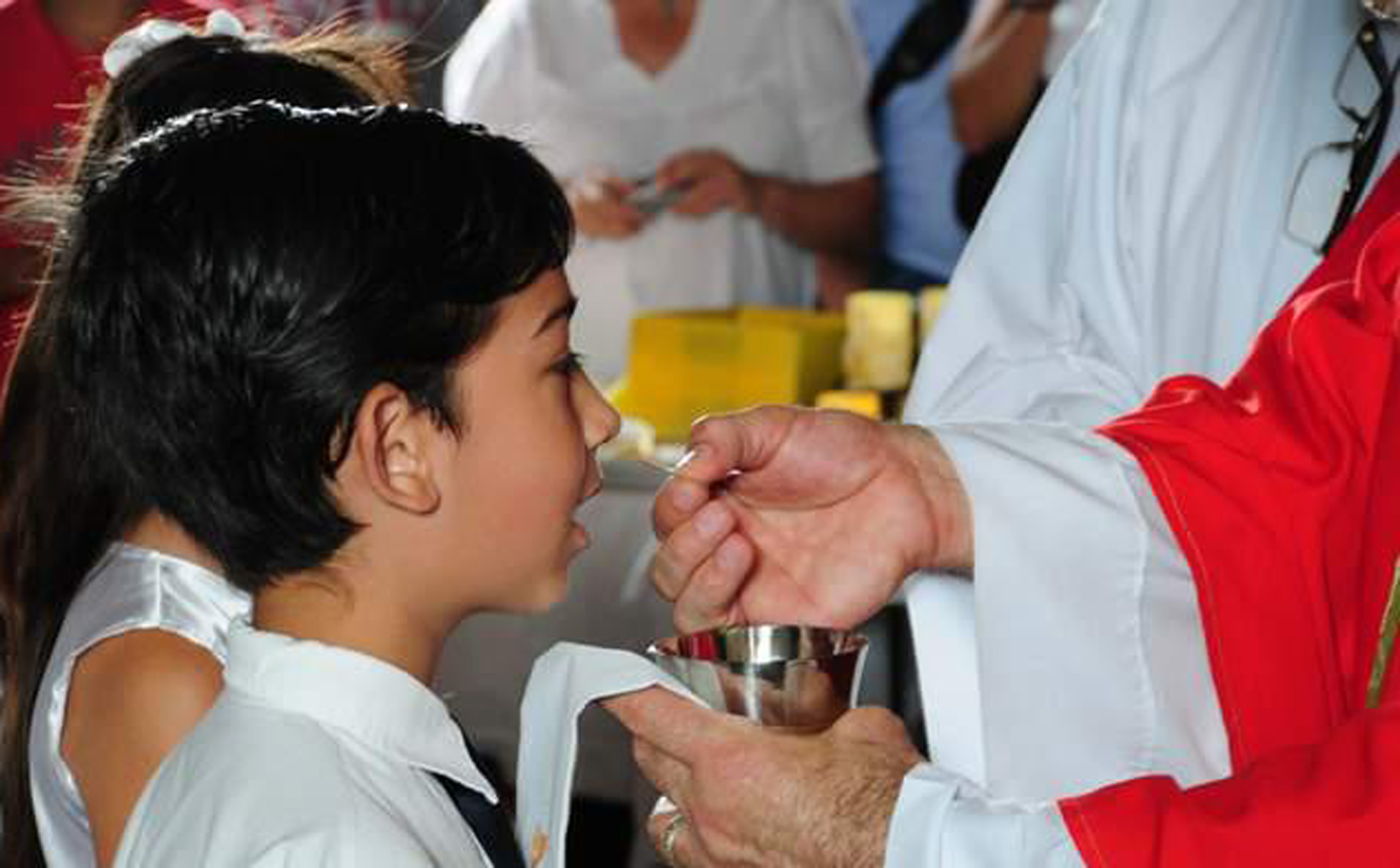 A child receiving the First Communion