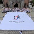 Photo de groupe prise lors de la Journée de la fraternité des volontaires, le 17 juillet 2026