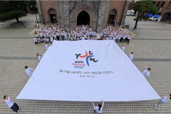 Photo de groupe prise lors de la Journée de la fraternité des volontaires, le 17 juillet 2026