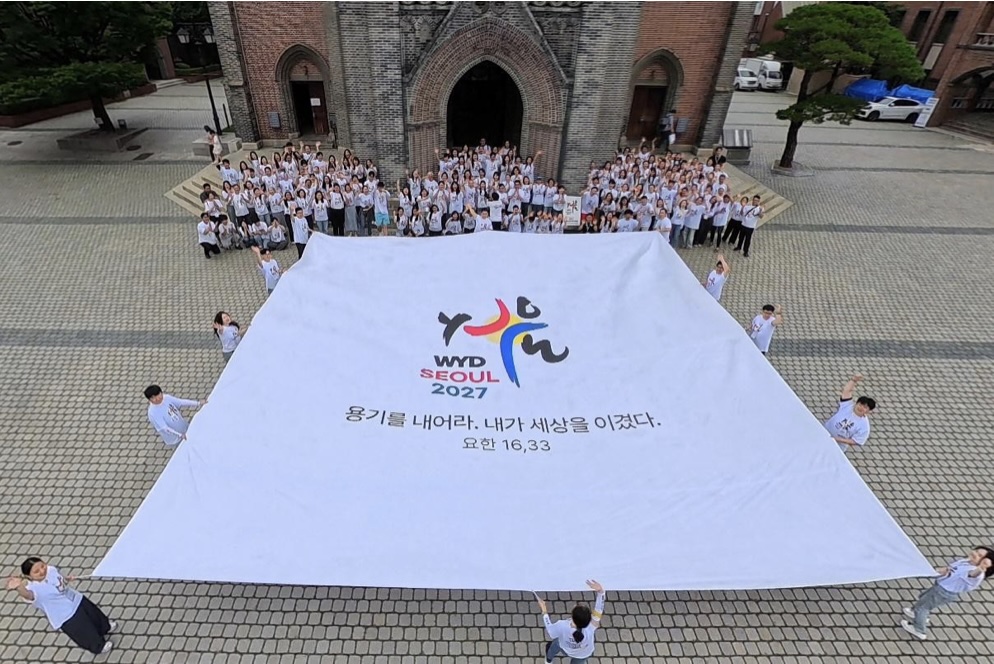 Photo de groupe prise lors de la Journée de la fraternité des volontaires, le 17 juillet 2026
